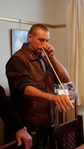 Nigel showing his expertise on straightening wooden arrows.