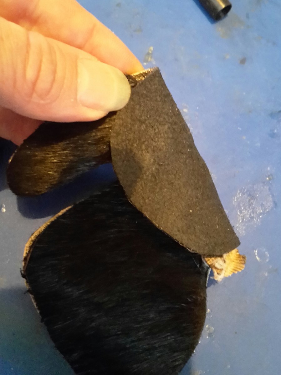 Finished leather tab showing how the leather can be folded over