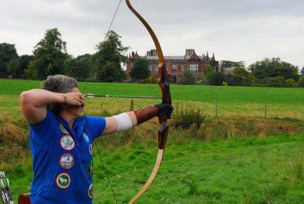 Trish shooting barebow