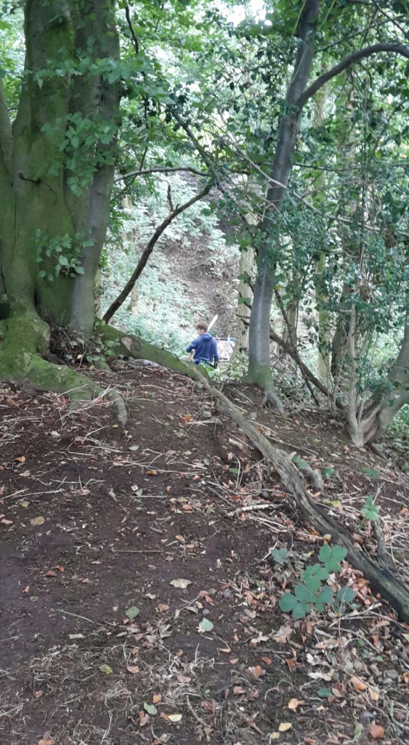 Paper face tiger between the trees