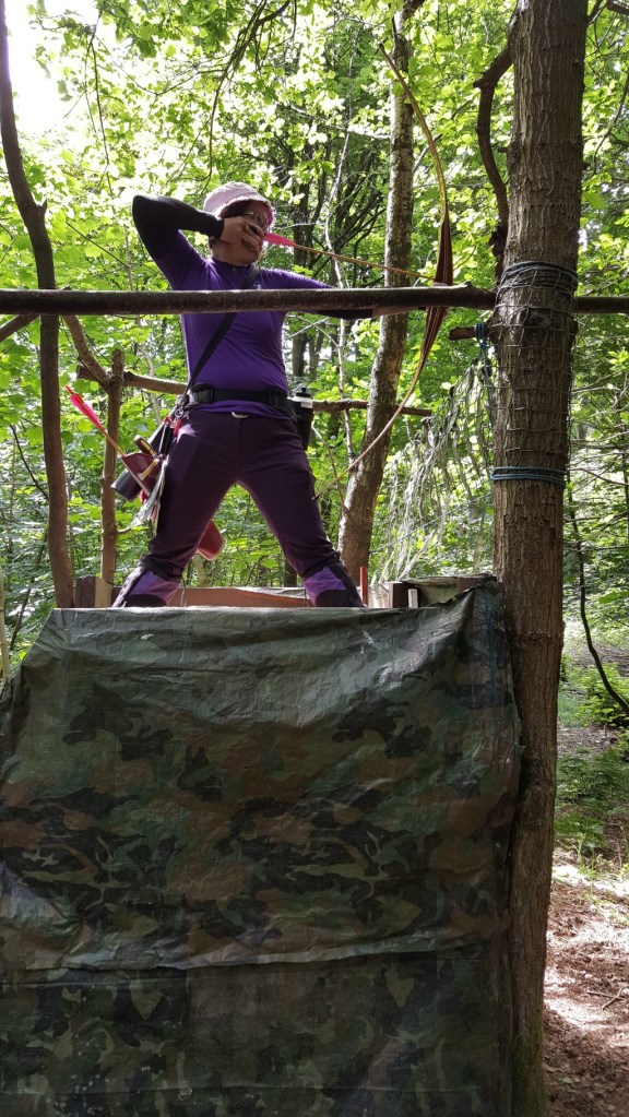 A slightly different angle showing Sharon shooting from the tower