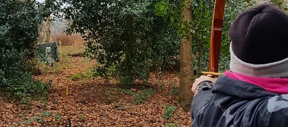 Sharon shooting a 3D dragon target at Paget de Vasey