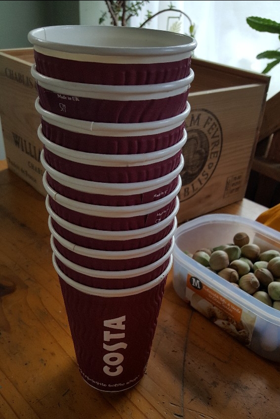 stack of Costa Coffee cups