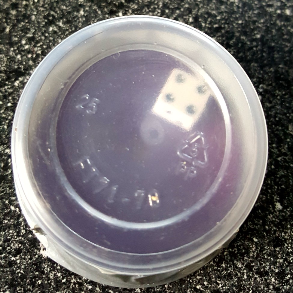 six sided dice in a clear box